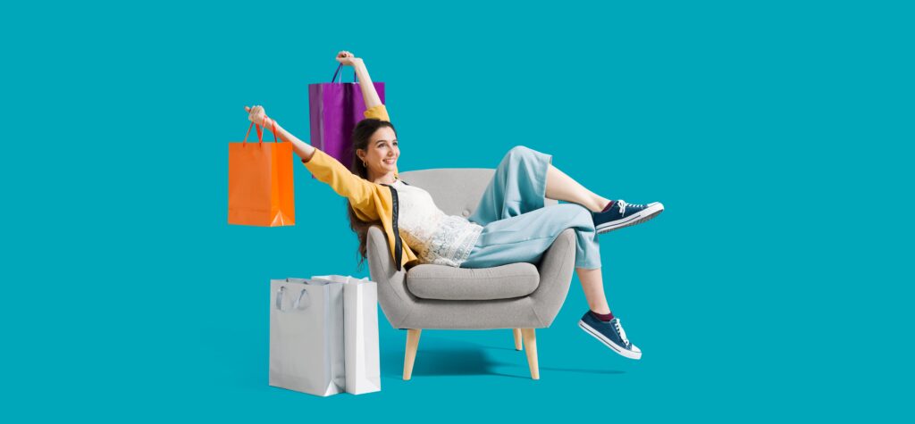 Woman sitting on a chair with shopping bags