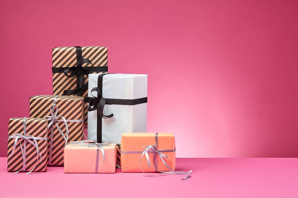 Wrapped gifts on pink background