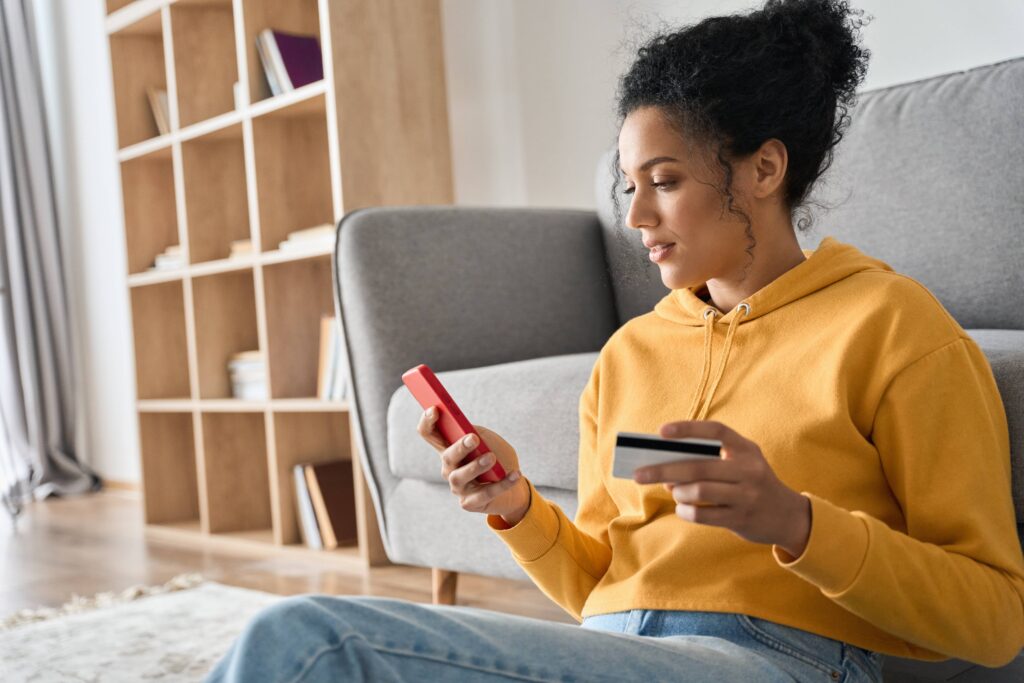 Woman on sofa making online purchase