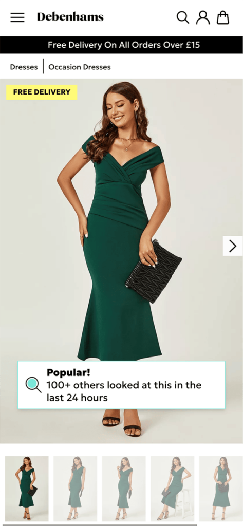 Debenhams webpage in mobile format showing a woman wearing a green dress with social proof stating "Popular! 100+ others looked at this in the last 24 hours"